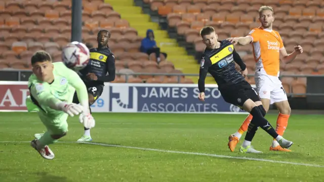 Jordan Rhodes sends a header just wide for Blackpool.