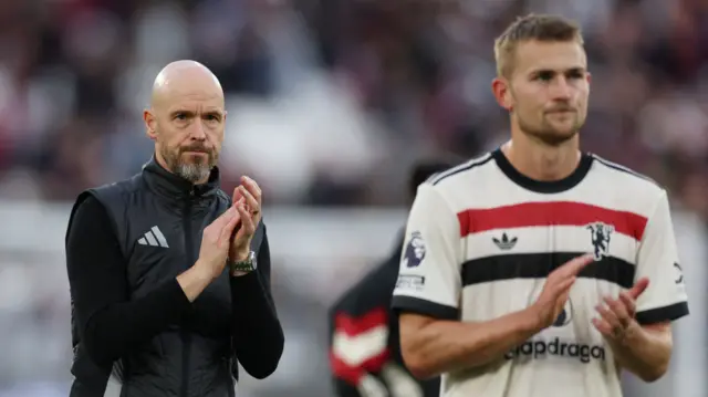 Manager Erik ten Hag and Matthijs de Ligt applaud the Manchester United fans after their defeat at West Ham