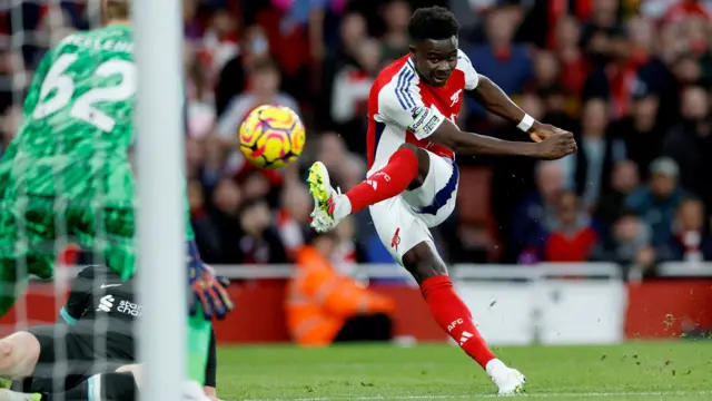 Bukayo Saka scores for Arsenal against Liverpool