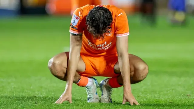 Blackpool's Kyle Joseph looks to the floor after their 5-1 loss to Peterborough