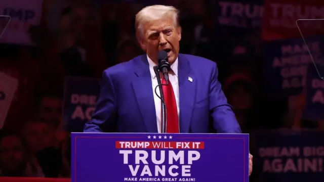 US President and Republican presidential candidate Donald Trump speaks at a podium at Madison Square Garden in New York, New York, USA, 27 October 2024