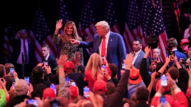 Republican presidential nominee Donald Trump gestures accompanied by Melania Trump during a rally at Madison Square Garden