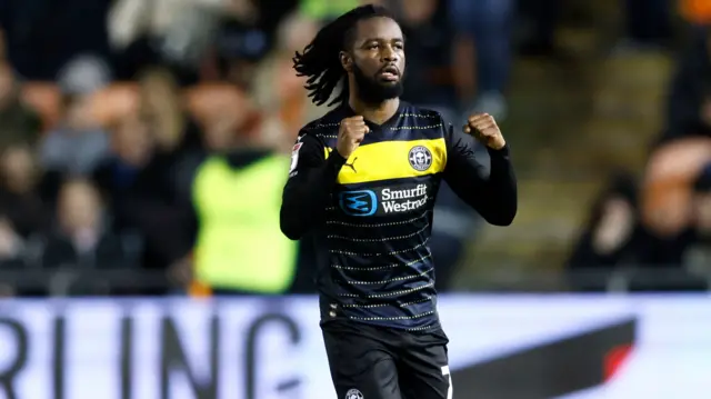 Wigan's Dion Rankine celebrates his goal at Bloomfield Road.