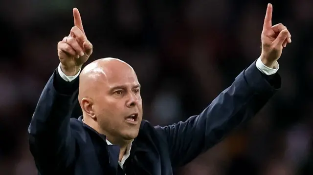 Manager Arne Slot signals to his Liverpool players during their draw at Arsenal