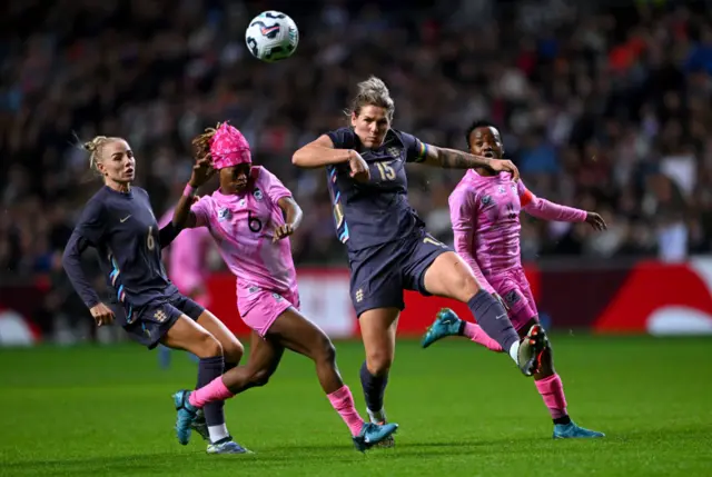 Millie Bright clearing the ball