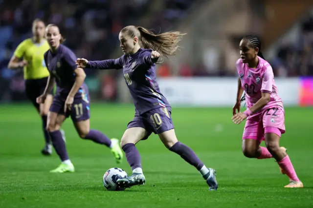 Jess Park of England runs with the ball whilst under pressure from Amogelang Motau