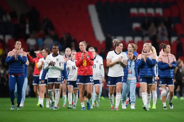 England players clap fans