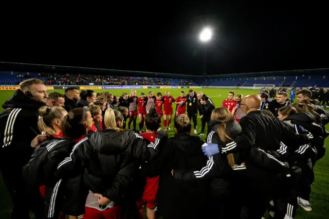 Wales players in a huddle in Slovakia