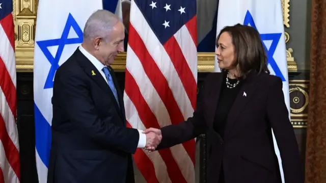 Israel Prime Minister Benjamin Netanyahu (L) shakes hands with US Vice President Kamala Harris (R) during a meeting in July 2024