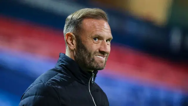 Ian Evatt smiling at Bolton Wanderers game