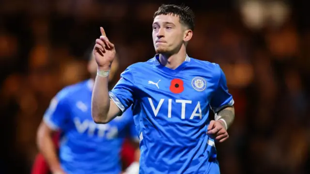 Stockport's Louie Barry celebrates after scoring a penalty against Reading