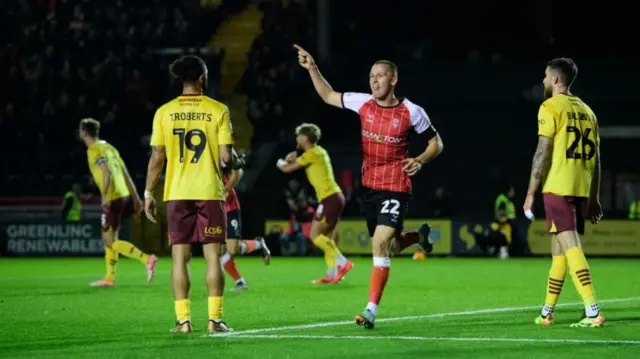 Lincoln's Tom Hamer celebrates his goal against Northampton