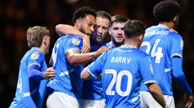 Stockport players celebrate taking a 3-1 lead against Reading