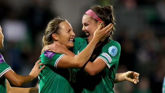 Kyra Carusa celebrates scoring the second goal with Julie-Ann Russell