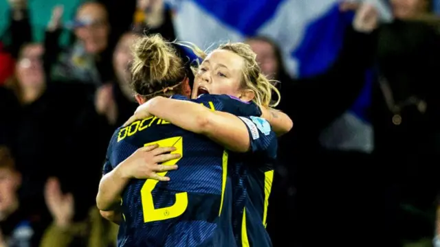 Erin Cuthbert celebrates with Nic Docherty after making it 2-0 to Scotland.