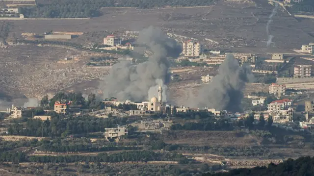 Smoke rises above a village in southern Lebanon following an Israeli airstrike