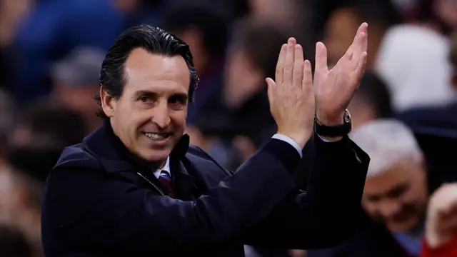 Manager Unai Emery applauds the Aston Villa fans during his team's win over Bayern Munich