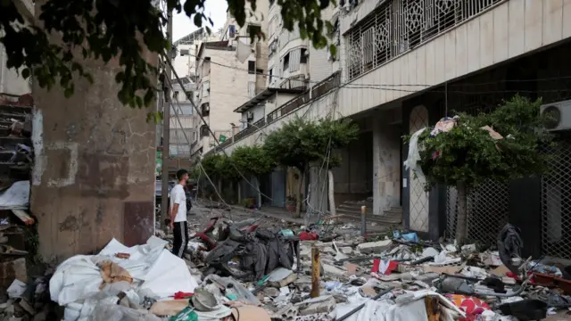 A man stands at the site of an Israeli strike on central Beirut's Bachoura neighbourhood, amid ongoing hostilities between Hezbollah and Israeli forces, in Beirut