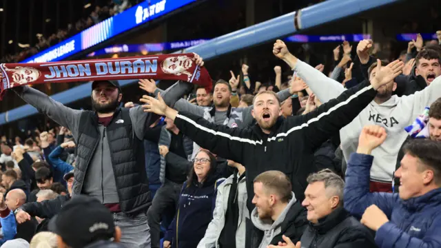 Aston Villa fans celebrate their team's win over Bayern Munich