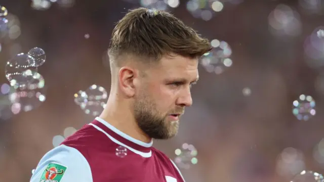 Niclas Fullkrug walks through bubbles at the London Stadium