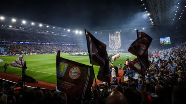 Aston Villa fans celebrate the team's win over Bayern Munich at Villa Park