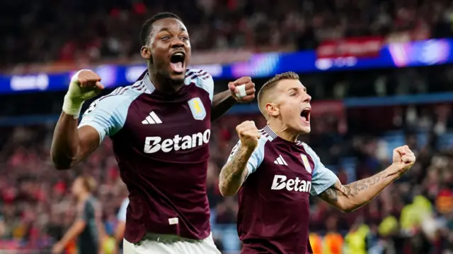 Jhon Duran and Lucas Digne celebrate after Aston Villa's win over Bayern Munich