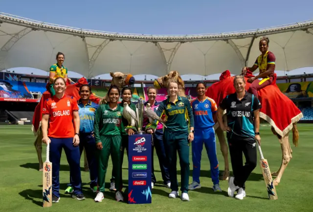 Women's T20 World Cup captains pose with the trophy, birds of prey and camels