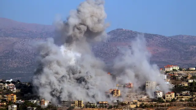 Smoke rises above the village of Khiam near the border with Israel in southern Lebanon,