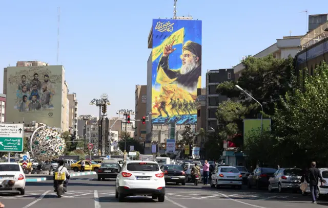 Cars drive past a billboard of late Hezbollah Leader Hasan Nasrallah in Tehran, Iran. Photo: 3 October 2024