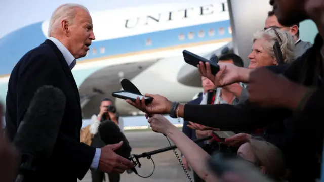 US President Joe Biden answers reporters questions at Joint Base Andrews on Thursday