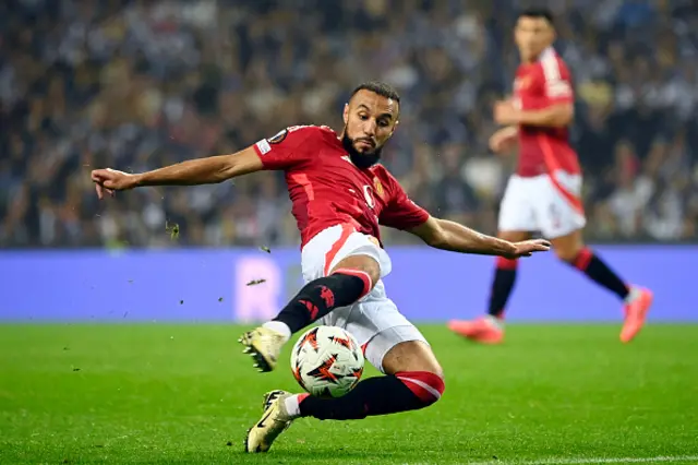 Noussair Mazraoui kicks the ball