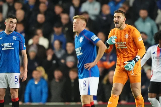 Jack Butland (centre right) reacts after Lyon's Alexandre Lacazette scores