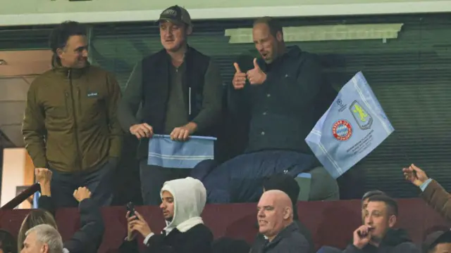 Prince William with his thumbs up while watching Aston Villa's win over Bayern Munich