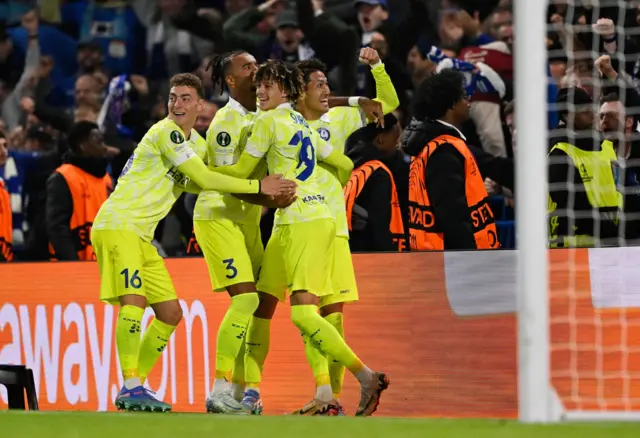 Gent players celebrate in front of fans