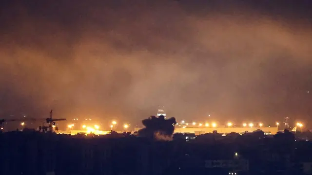 Smoke rises over Beirut's southern suburbs after a strike, amid the ongoing hostilities between Hezbollah and Israeli forces