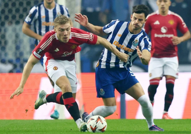 Manchester United's Rasmus Hojlund in action with FC Porto's Ze Pedro