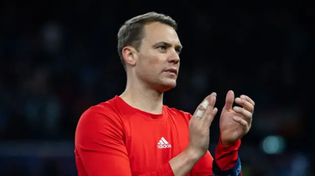 Manuel Neuer looks side while clapping after Bayern Munich's defeat to Aston Villa