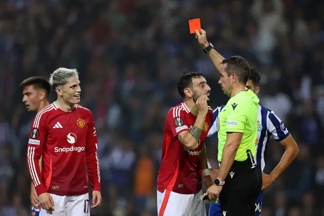 Referee Tobias Stieler shows a red card to Bruno Fernandes of Manchester United following a second yellow card d