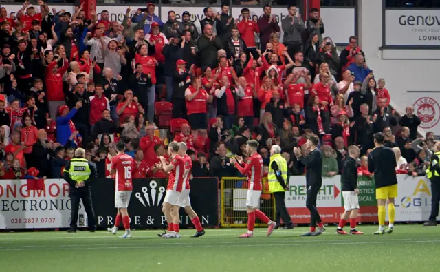 Larne's fans and players celebrate