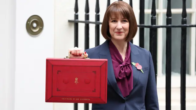 Rachel Reeves poses with the red budget box