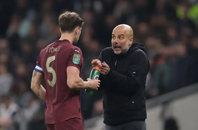 Pep Guardiola Manager / Head Coach of Manchester City talks to John Stones