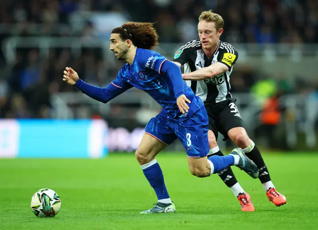 Marc Cucurella of Chelsea is challenged by Sean Longstaff