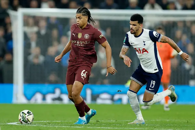 Jahmai Simpson-Pusey of Manchester City and Dominic Solanke of Tottenham Hotspur challenge