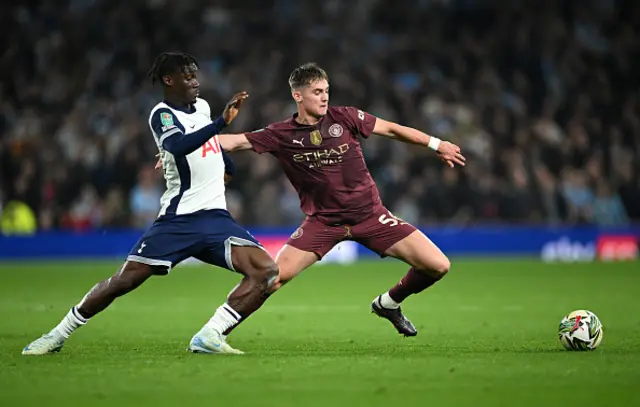 acob Wright of Manchester City is challenged by Yves Bissouma