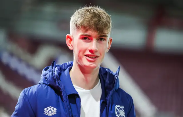 James Wilson makes do with a place on the bench after his late goal against Hibs