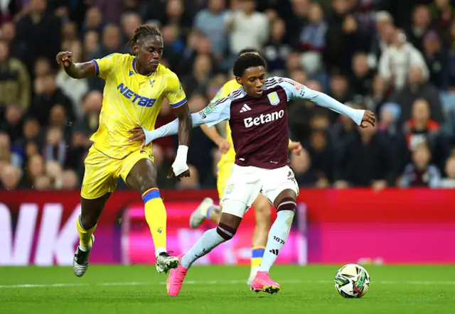 Jaden Philogene-Bidace of Aston Villa is challenged by Trevoh Chalobah