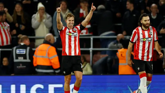 James Bree points to the sky in celebration