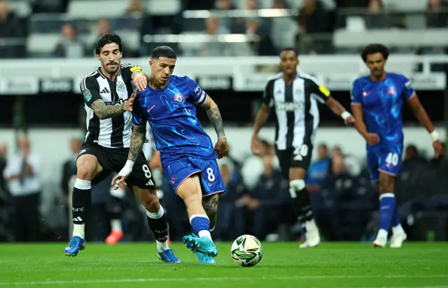 Enzo Fernandez of Chelsea passes the ball under pressure from Sandro Tonali