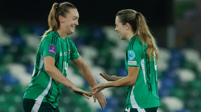 Northern Ireland's goal scorer Lauren Wade (left) celebrates with her captain Simone Magill after winning the second leg of the UEFA Women's Euro 2025 Qualifying play off match.