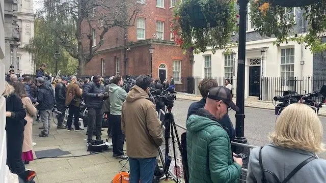 Journalists and cameras line the street outside 10 Downing Street